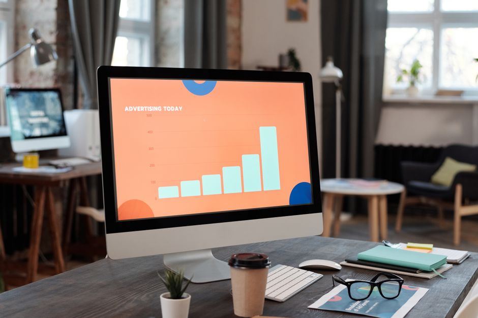 Media buyer reviewing paid ad campaign performance on a laptop